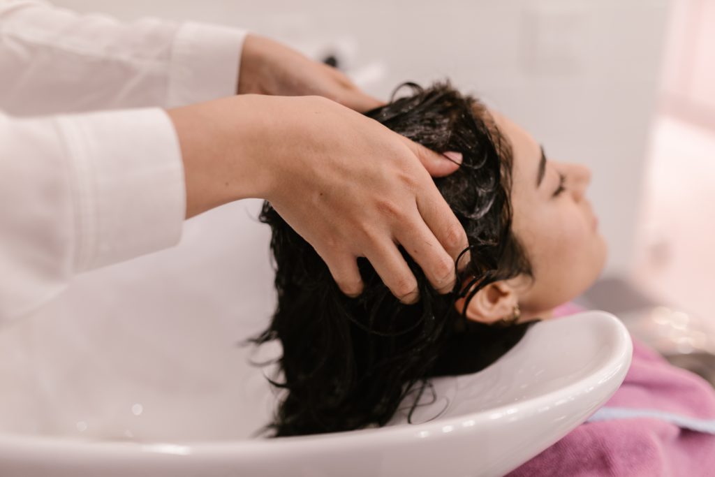 How Washing Your Hair Less Benefits Your Hair